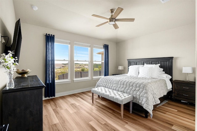 bedroom featuring light hardwood / wood-style flooring and ceiling fan