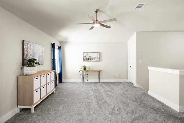 interior space with ceiling fan and carpet floors