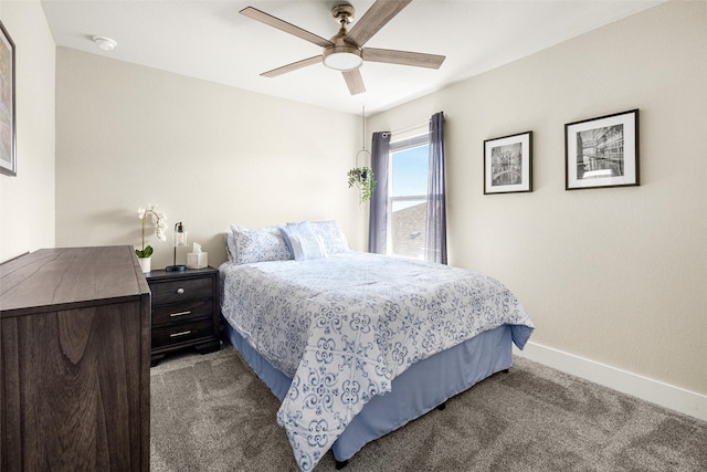 bedroom with ceiling fan and dark colored carpet