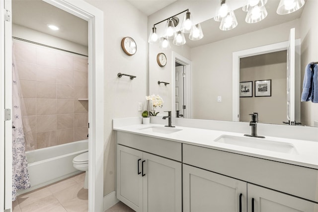 full bathroom featuring tile patterned flooring, vanity, shower / tub combo with curtain, and toilet