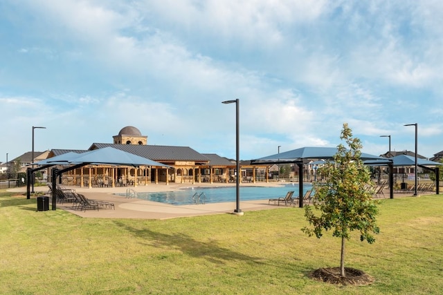 view of swimming pool featuring a yard and a gazebo