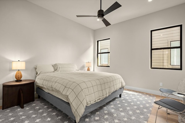 bedroom featuring lofted ceiling and ceiling fan