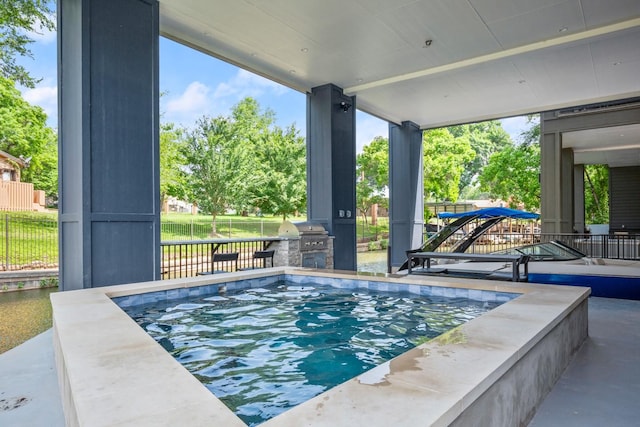 view of pool featuring area for grilling and grilling area