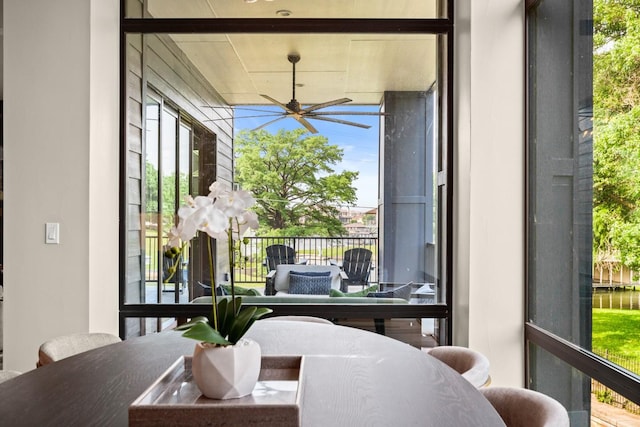 sunroom / solarium with ceiling fan