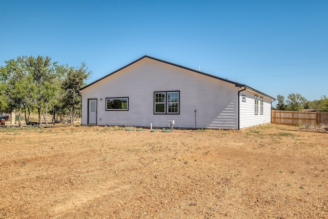 view of side of home featuring a yard