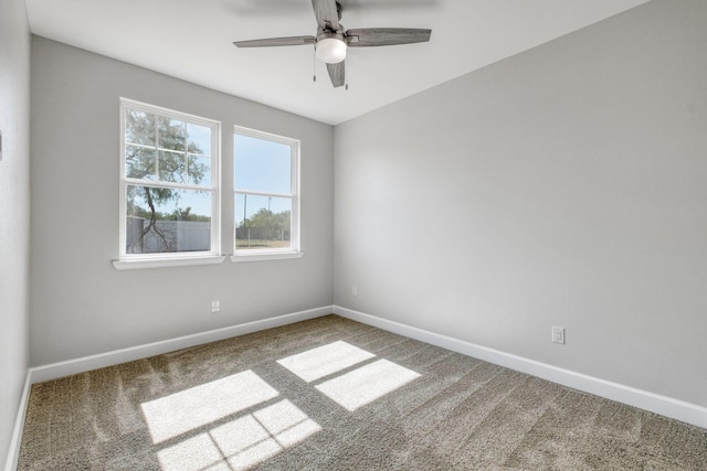 carpeted empty room featuring ceiling fan