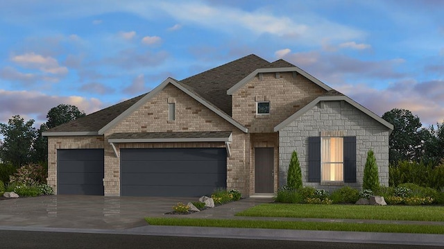 view of front of home with a garage