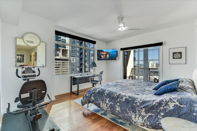 bedroom featuring hardwood / wood-style flooring and ceiling fan