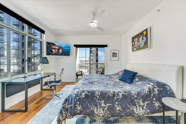 bedroom with ceiling fan and hardwood / wood-style floors