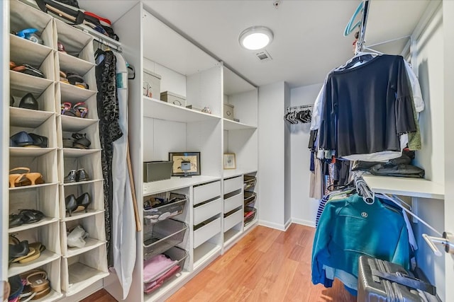 spacious closet featuring light hardwood / wood-style flooring