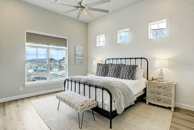 bedroom featuring hardwood / wood-style flooring and ceiling fan