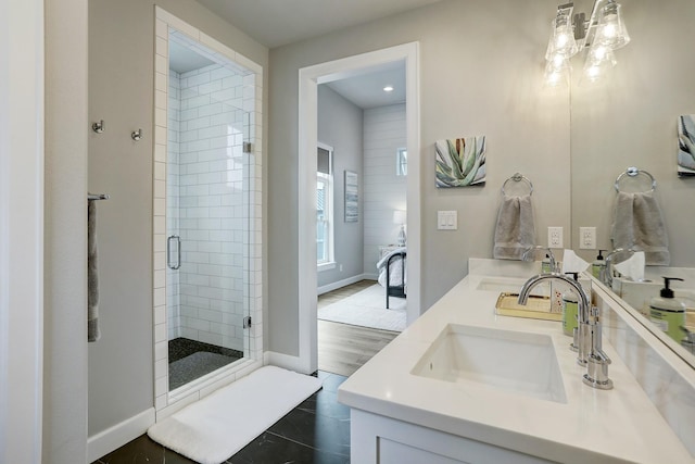 bathroom featuring vanity, an enclosed shower, and tile patterned flooring