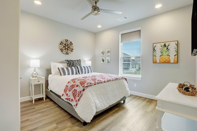 bedroom with ceiling fan and light hardwood / wood-style floors