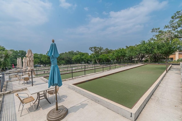 404 Eagle Dr, San Marcos, TX 78666 - surrounding community with a game area and view of wooded area
