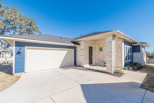 404 Eagle Dr, San Marcos, TX 78666 - ranch-style home featuring stone siding, concrete driveway, and an attached garage