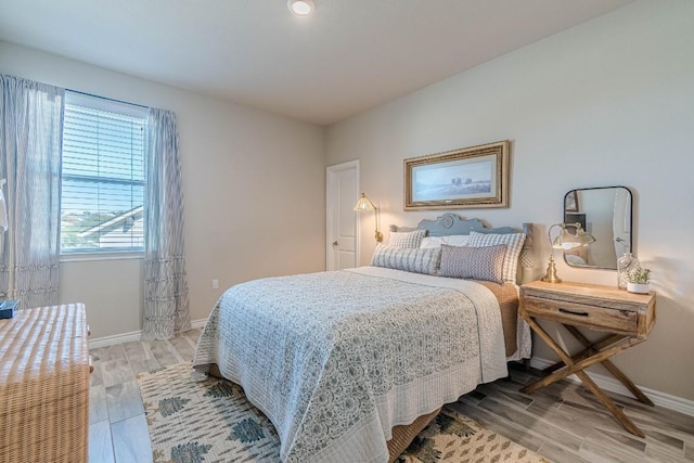 404 Eagle Dr, San Marcos, TX 78666 - bedroom with baseboards and light wood finished floors