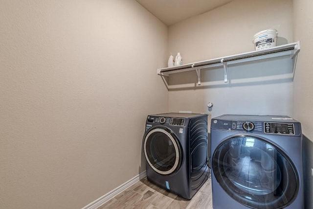 404 Eagle Dr, San Marcos, TX 78666 - washroom featuring separate washer and dryer and light wood-style flooring