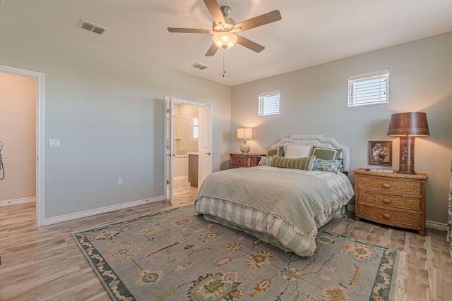 404 Eagle Dr, San Marcos, TX 78666 - bedroom featuring light wood finished floors, ceiling fan, and ensuite bathroom