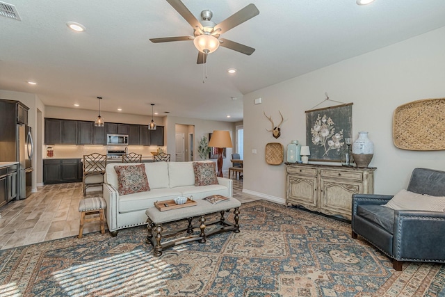 living room featuring ceiling fan