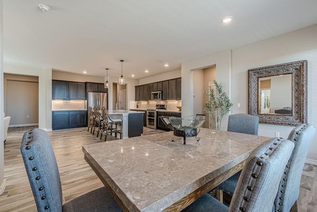 404 Eagle Dr, San Marcos, TX 78666 - dining room featuring light wood-type flooring and recessed lighting
