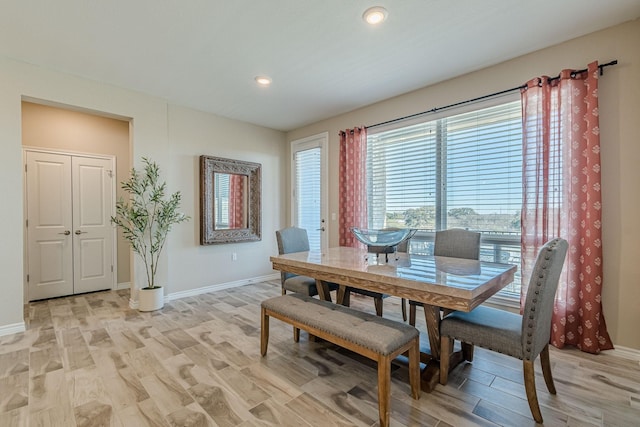 dining space featuring light hardwood / wood-style floors