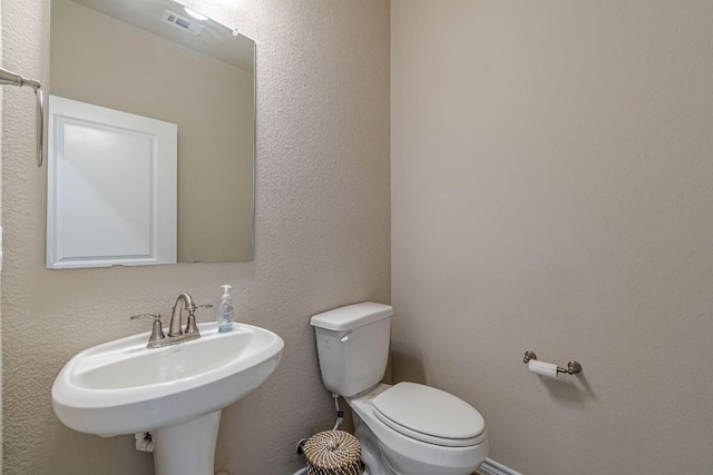 404 Eagle Dr, San Marcos, TX 78666 - half bath featuring toilet and a sink