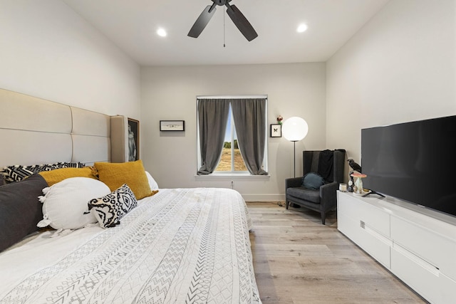 bedroom featuring ceiling fan and light hardwood / wood-style floors