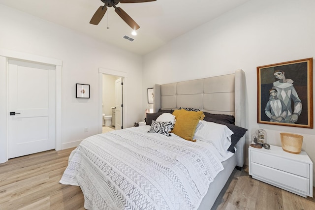 bedroom with connected bathroom, ceiling fan, and light hardwood / wood-style floors