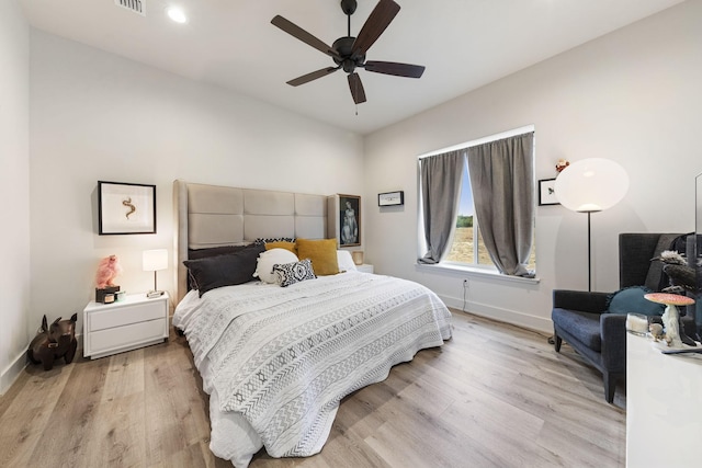 bedroom with ceiling fan and light hardwood / wood-style floors