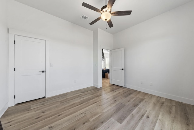 unfurnished bedroom featuring ceiling fan and light wood-type flooring