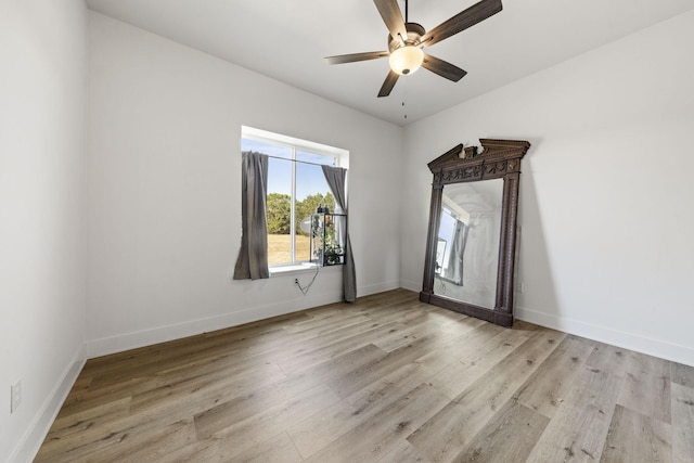 spare room featuring ceiling fan and light hardwood / wood-style floors