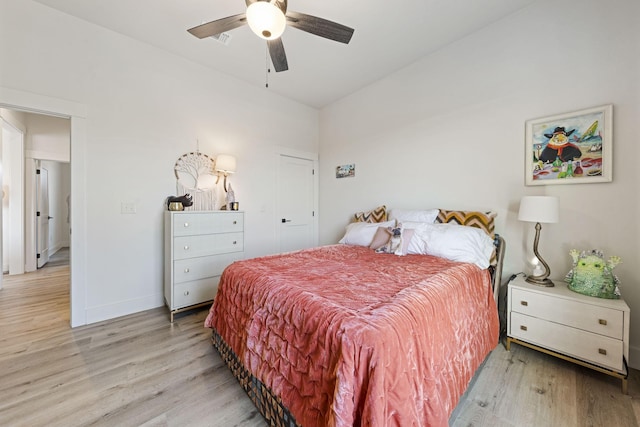 bedroom with ceiling fan and light hardwood / wood-style flooring