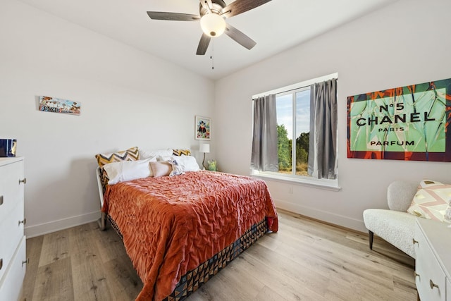 bedroom featuring ceiling fan and light hardwood / wood-style flooring