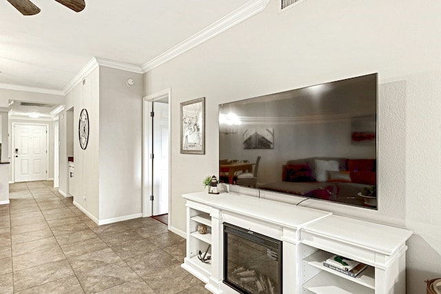 living room with crown molding, ceiling fan, and light tile patterned floors