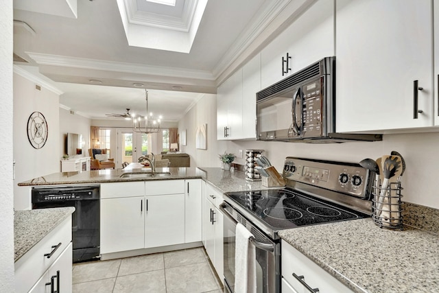 kitchen featuring sink, black appliances, white cabinets, and light tile patterned flooring