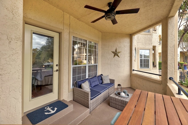 exterior space featuring ceiling fan and an outdoor living space