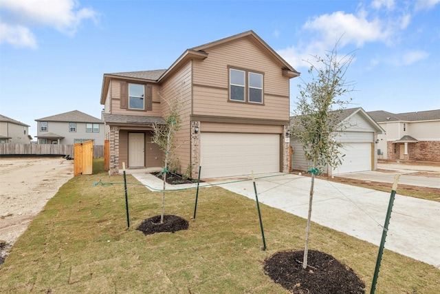 view of front of property with a garage and a front lawn