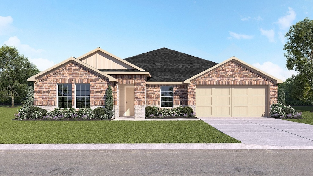 view of front of home featuring a garage and a front yard