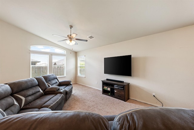 carpeted living room with lofted ceiling and ceiling fan