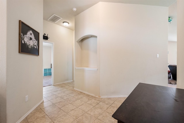 hallway featuring light tile patterned flooring