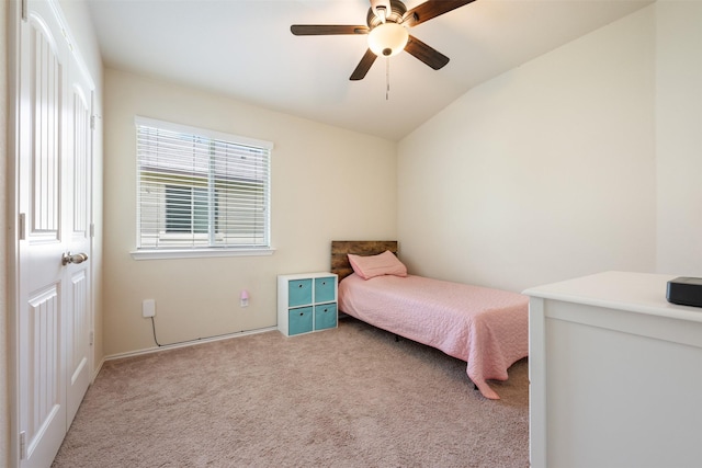 bedroom featuring lofted ceiling, light carpet, and ceiling fan