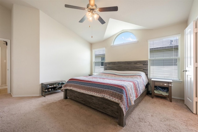 bedroom with high vaulted ceiling, light colored carpet, and ceiling fan