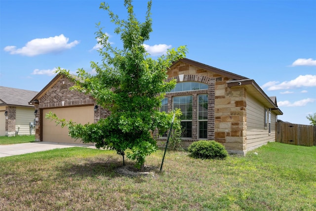 view of front facade with a garage and a front lawn