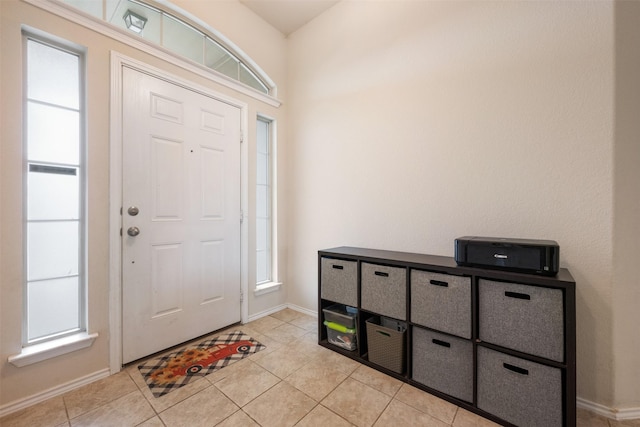 foyer featuring light tile patterned flooring