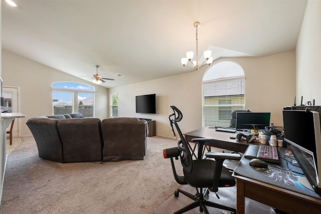 carpeted office featuring ceiling fan with notable chandelier and vaulted ceiling