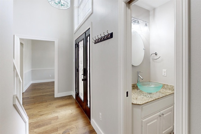 interior space with sink and light hardwood / wood-style flooring