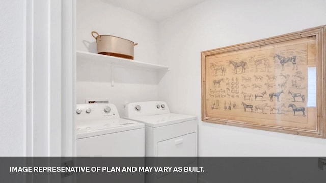 washroom featuring washer and clothes dryer