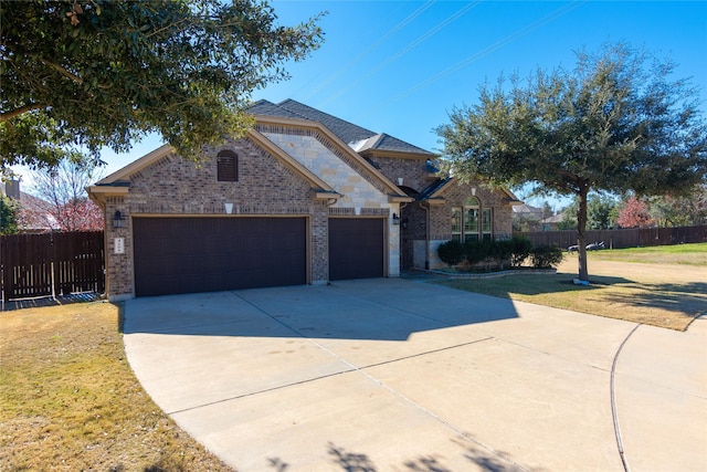 view of front facade with a garage and a front yard