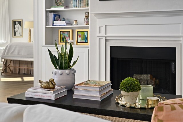 details with built in shelves and wood-type flooring