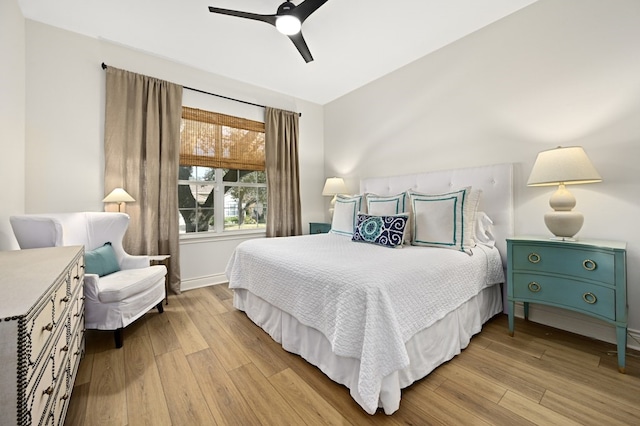 bedroom featuring ceiling fan and light hardwood / wood-style floors